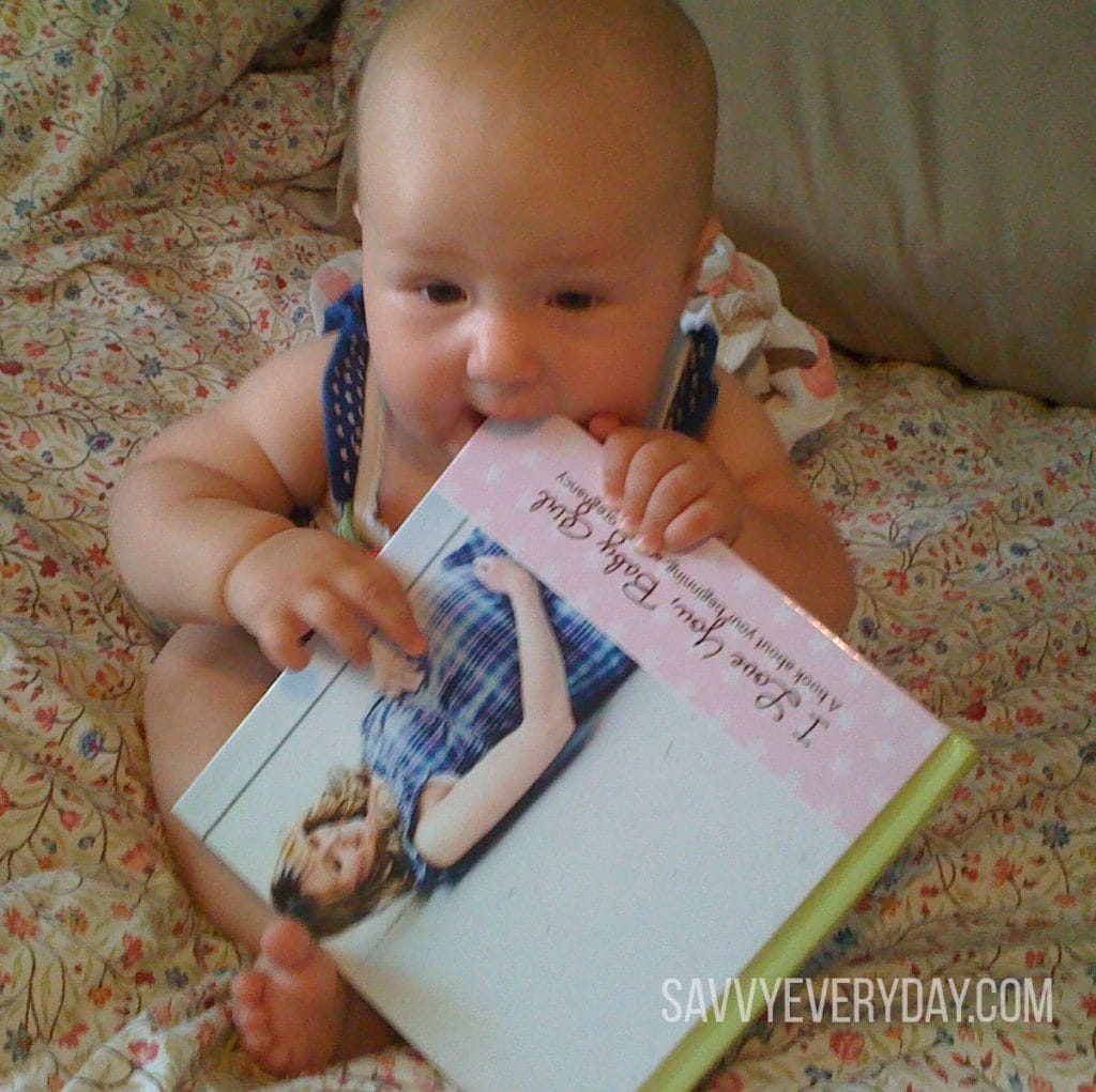 Baby eating book