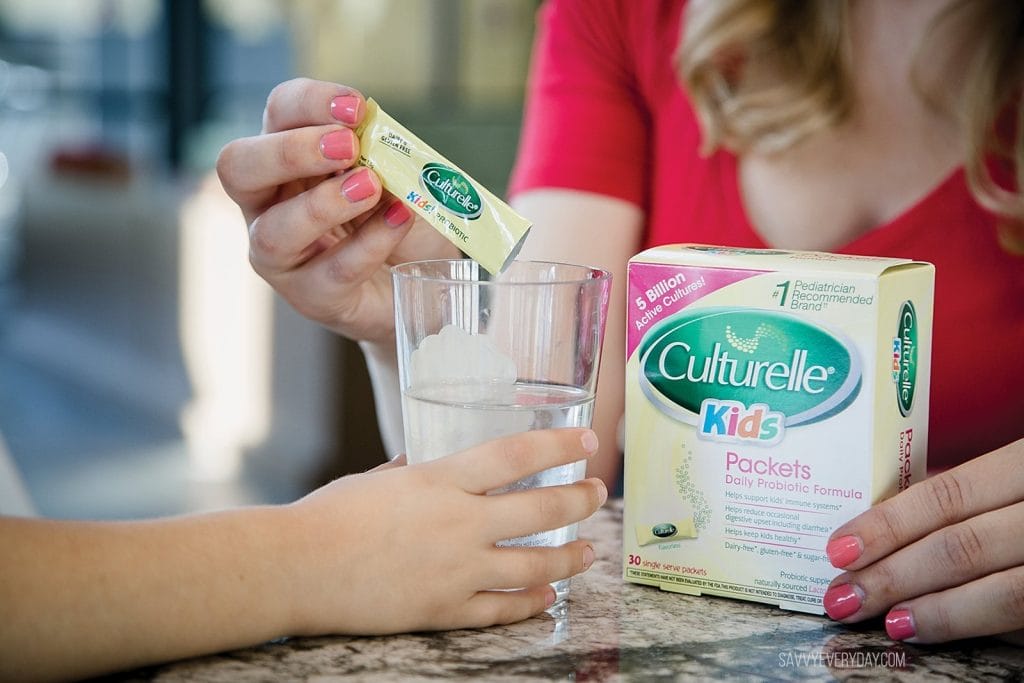 pouring Culturelle kids probiotic in a cup