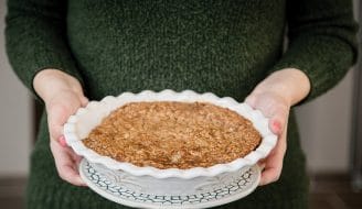 holding apple crumble pie