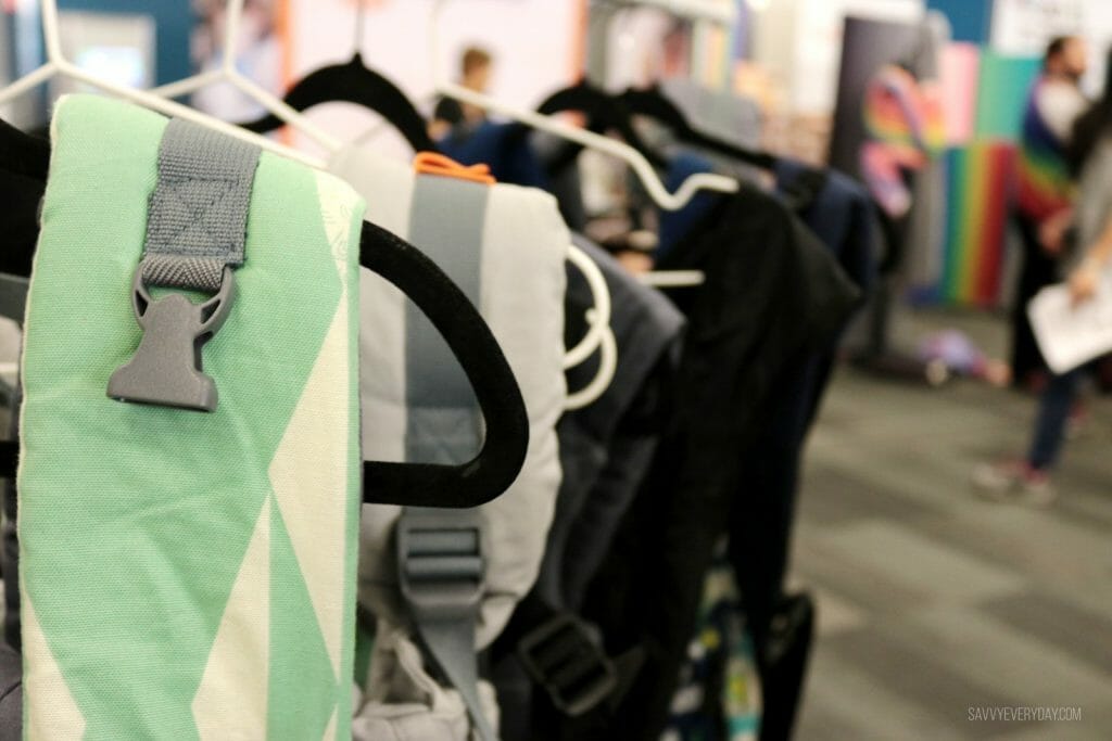 hanging rack of soft structured baby carriers