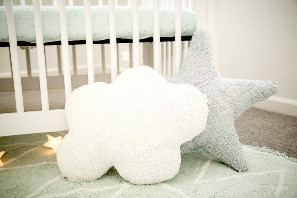 cloud and star pillows on the floor