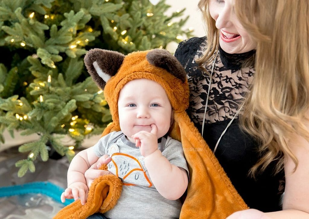 baby in fox onesie and hooded fox blanket