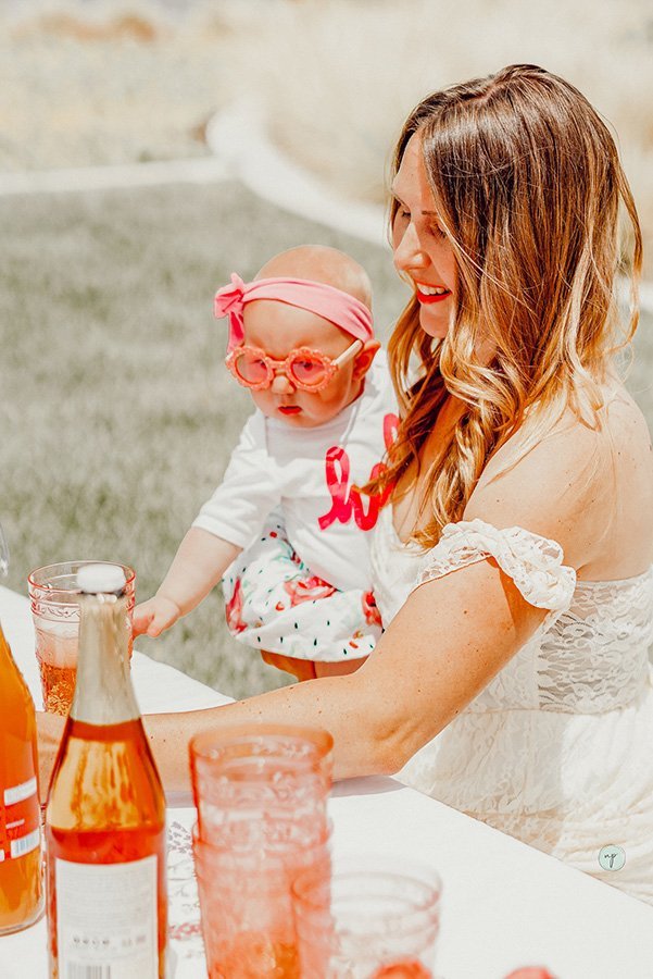 mom and baby getting drinks outside