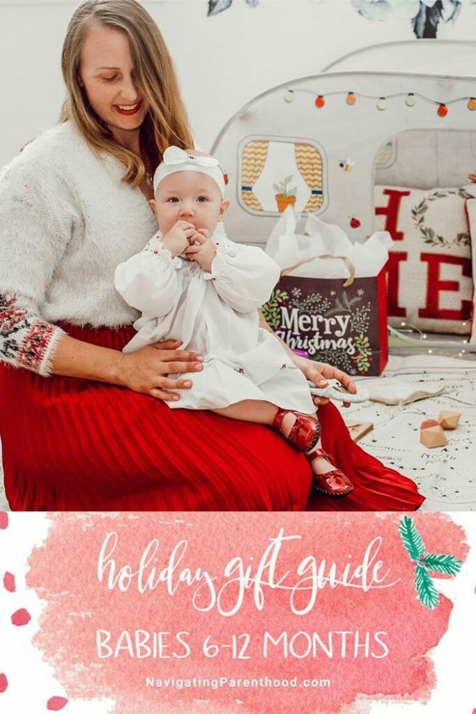 mom and baby sitting in floor in Christmas dresses