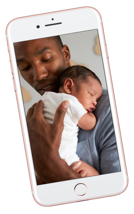 Black dad holding newborn baby