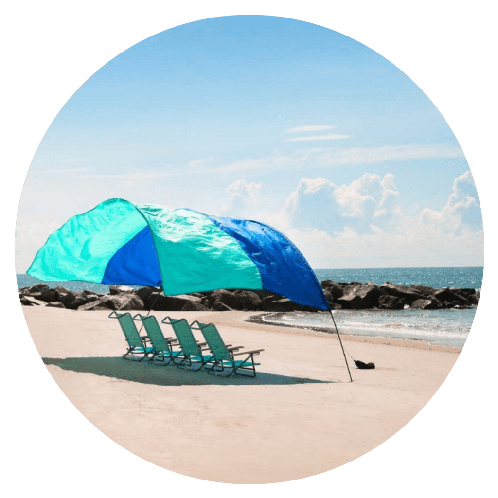 travel shade flying over chairs at the beach