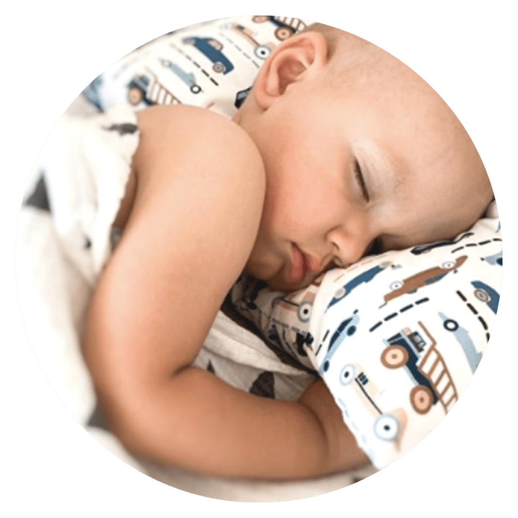 Toddler asleep on pillow