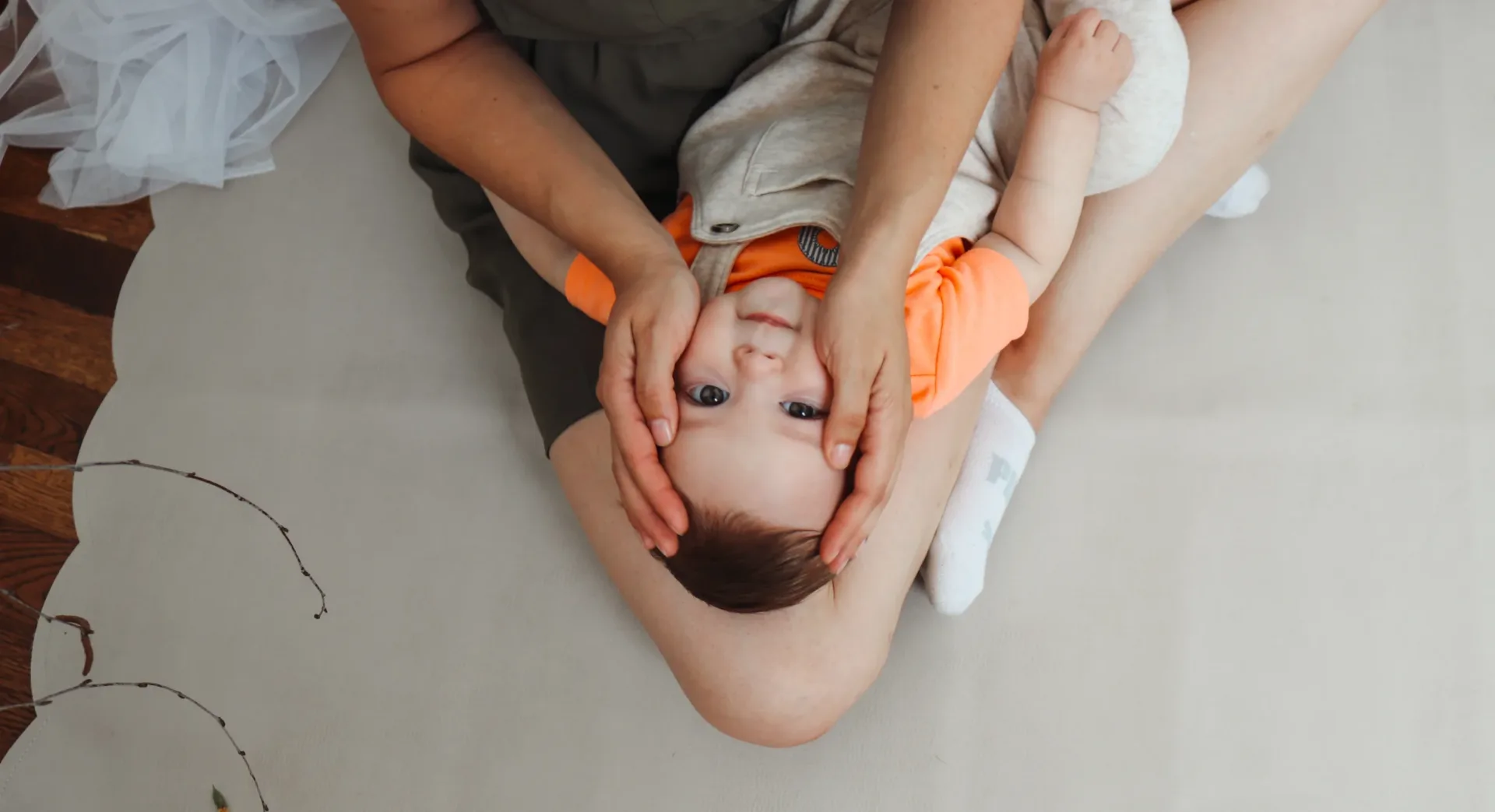 Upside down baby face massage
